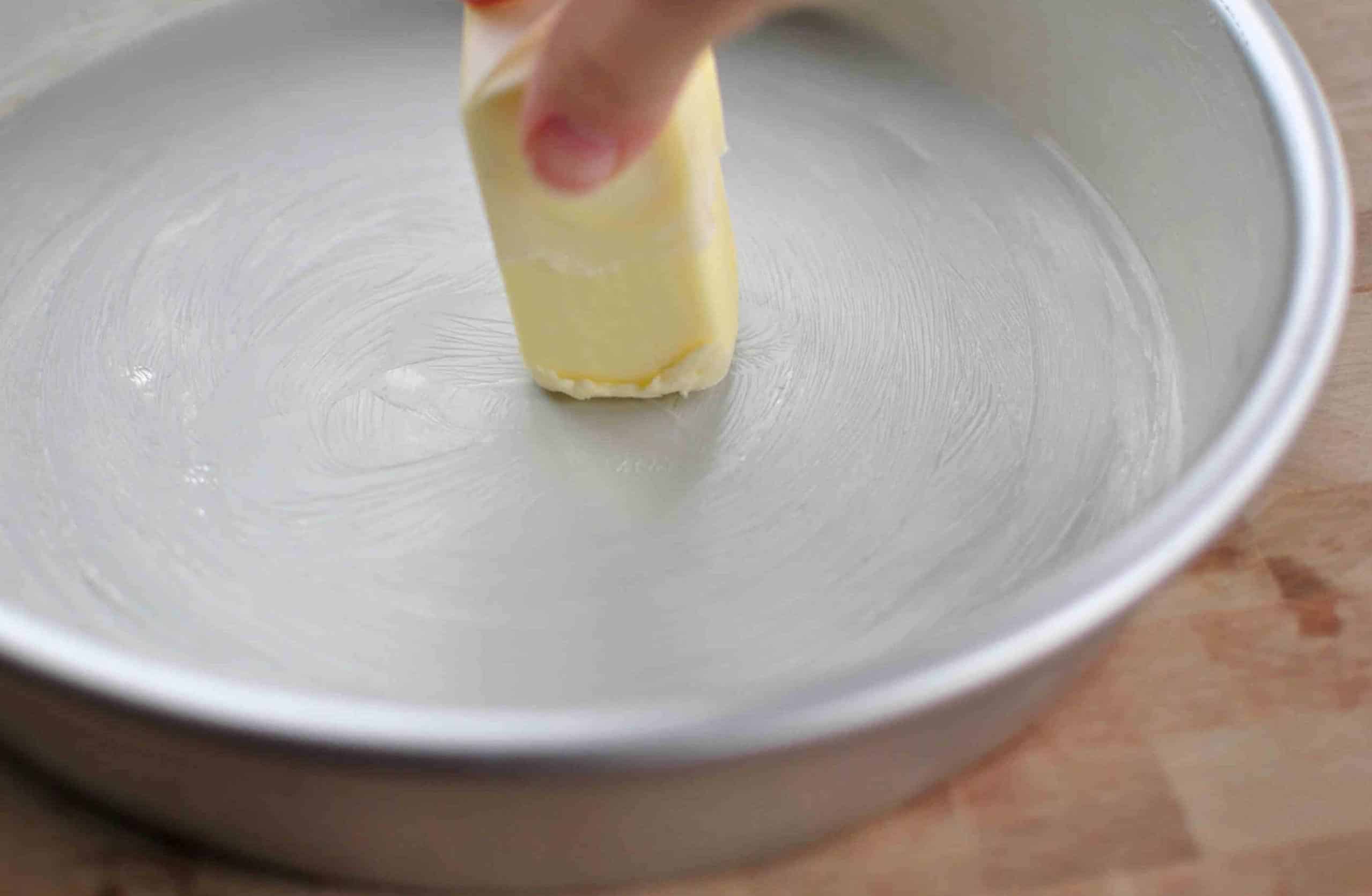Grease a cake pan using the Butter and Flour